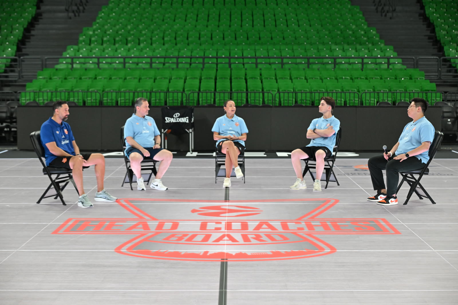 EHCB coaches sharing an Academy roundtable on court